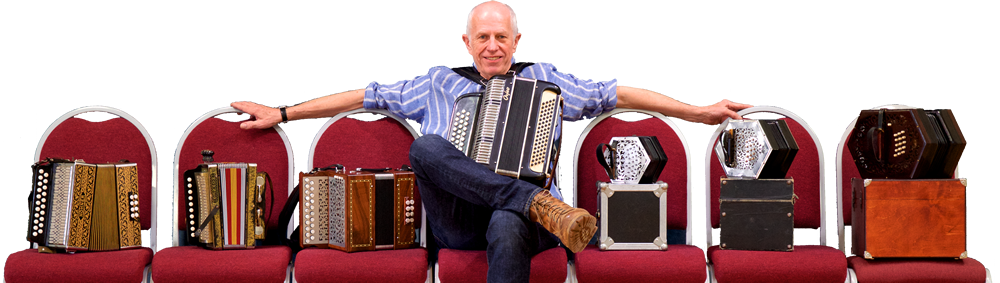 Photo of John Kirkpatrick with accordions on chairs
